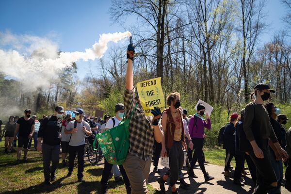 People protest Atlanta’s plan to build a police and fire training center known to critics as “Cop City,” in Gresham Park near Atlanta, March 4, 2023. Atlanta is ready to build the complex, but opponents say that it will further militarize officers and destroy precious green space. (Nicole Craine/The New York Times)