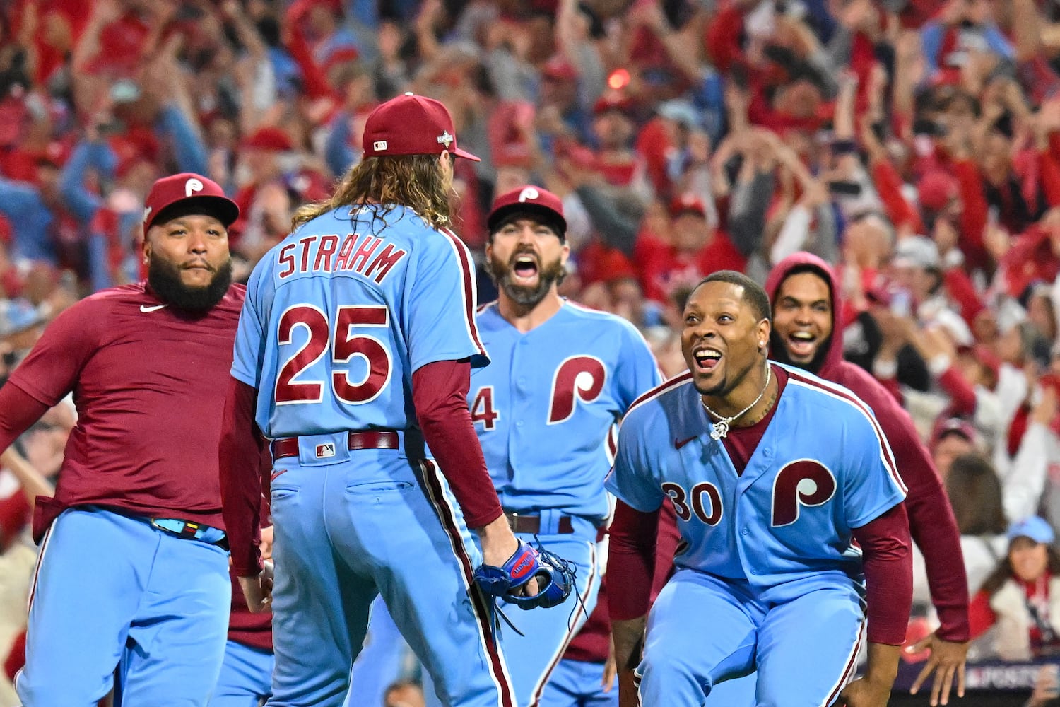 Philadelphia Phillies relief pitcher Matt Strahm (25) celebrates with teammates after a 3-1 NLDS Game 4 win over the Atlanta Braves at Citizens Bank Park in Philadelphia on Thursday, Oct. 12, 2023.   (Hyosub Shin / Hyosub.Shin@ajc.com)