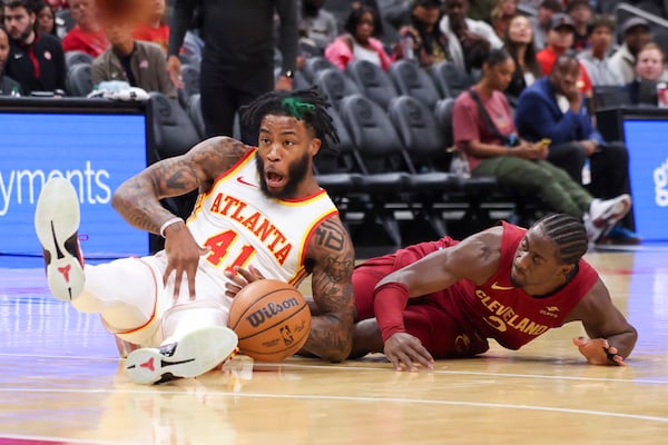 Atlanta Hawks forward Saddiq Bey (41) recovers a loose ball against Cleveland Cavaliers guard Caris LeVert (3) during the first half in a NBA preseason game at State Farm Arena, Tuesday, October 10, 2023, in Atlanta. (Jason Getz / Jason.Getz@ajc.com)