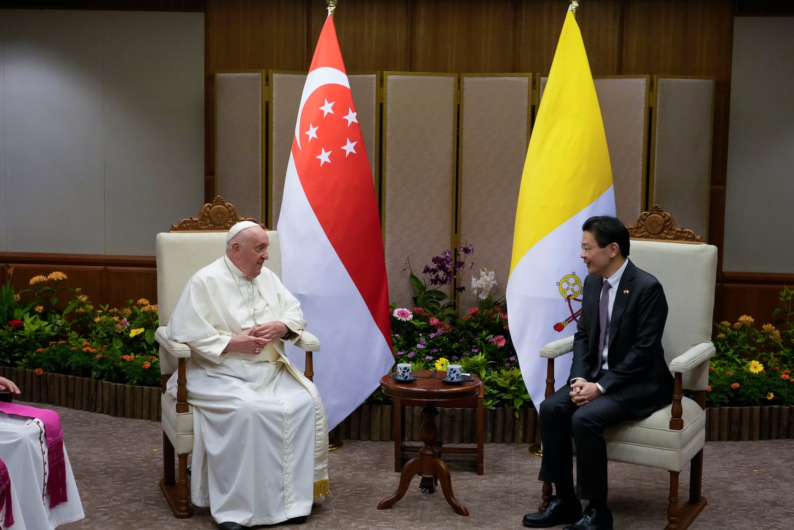 Pope Francis meets with the Prime Minister of Singapore, Lawrence Wong, right, at the Parliament House in Singapore, Thursday, Sept. 12, 2024. Pope Francis flew to Singapore on Wednesday for the final leg of his trip through Asia, arriving in one of the world's richest countries from one of its poorest after a record-setting final Mass in East Timor. (AP Photo/Gregorio Borgia, pool)