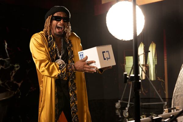 Lil Jon poses with a Cologuard at-home colon cancer screening test on the set of his "Get Low #2" promotional music video.