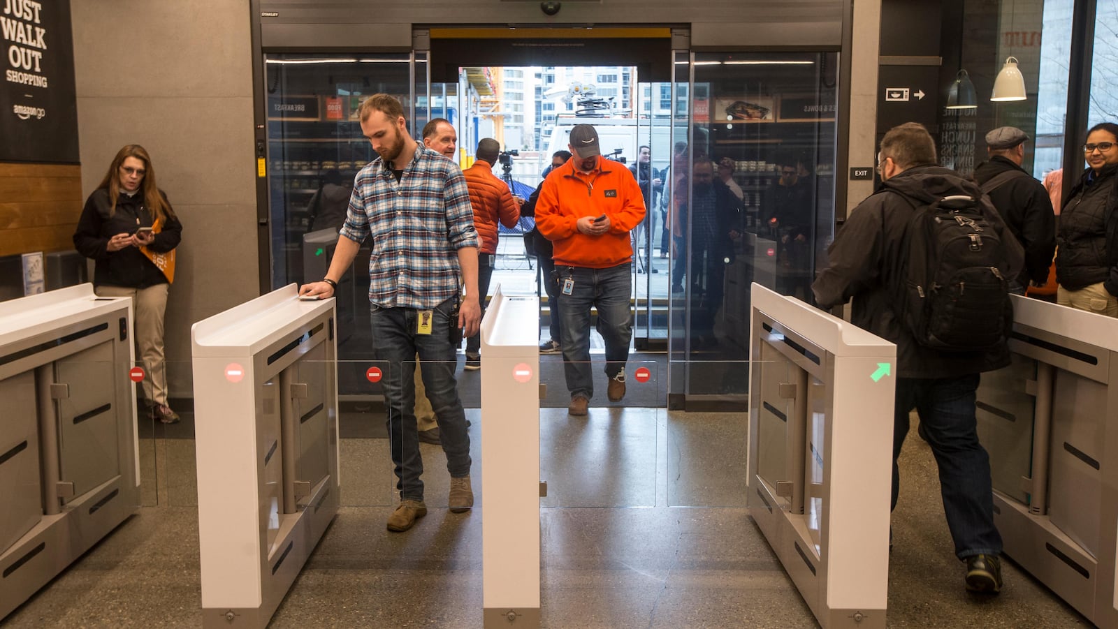 SEATTLE, WA - JANUARY 22: Shoppers enter and check out with purchases at the Amazon Go, on January 22, 2018 in Seattle, Washington. After more than a year in beta Amazon opened the cashier-less store to the public. (Photo by Stephen Brashear/Getty Images)