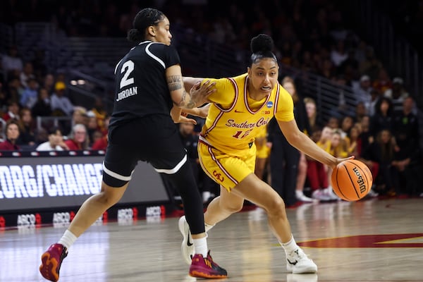 Southern California guard JuJu Watkins (12) dribbles against Mississippi State guard Jerkaila Jordan (2) during the first half in the second round of the NCAA college basketball tournament Monday, March 24, 2025, in Los Angeles. (AP Photo/Jessie Alcheh)