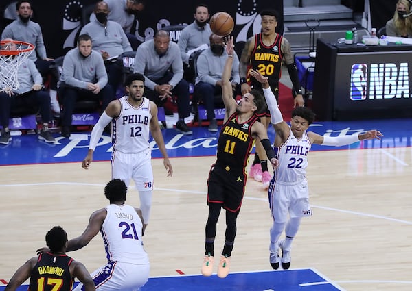 Hawks guard Trae Young drops in a floater for two points against the Philadelphia 76ers at the end of the third quarter of Game 7 of the Eastern Conference semifinals Sunday, June 20, 2021, in Philadelphia. (Curtis Compton / Curtis.Compton@ajc.com)