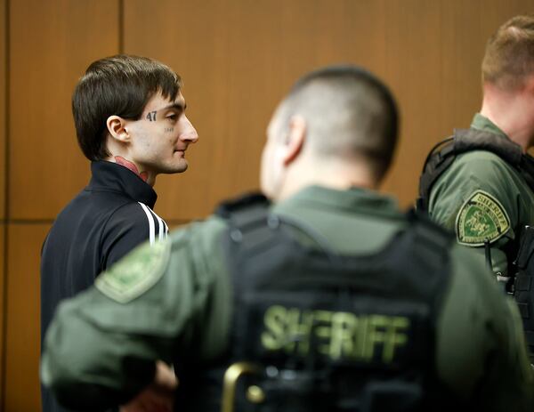 FILE- Robert Crimo III is escorted from the court room at a break in juror selection at the Lake County Courthouse Tuesday, Feb. 25, 2025, in Waukegan, Ill. (Brian Hill/Daily Herald via AP, Pool, File)