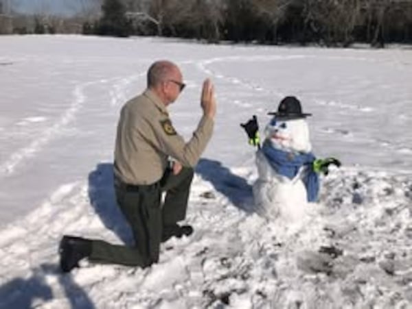 Crisp County Sheriff Billy Hancock jokingly swore in a 3-foot-tall snowman this week as a deputy, dubbing it “Crisp Nine” in honor of the area’s 9 inches of snow. (Crisp County Sheriff's Office)