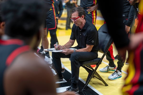 Atlanta Hawks Head Coach Quin Snyder calls a play during a timeout during the first half of an Emirates NBA Cup basketball game between the Cleveland Cavilers and the Atlanta Hawks on Friday, Nov. 29, 2024, in Atlanta. (AP Photo/Erik Rank)