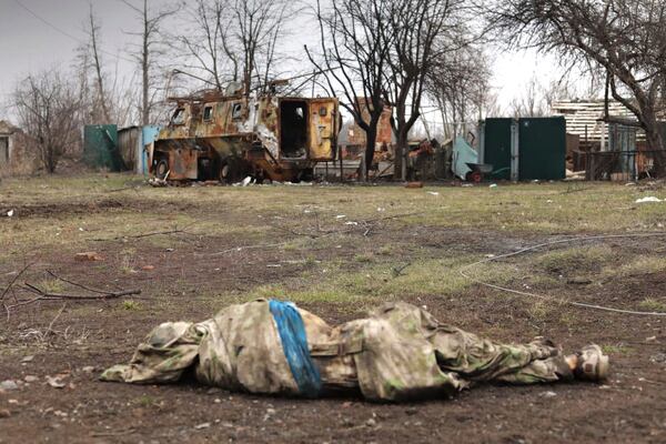 In this photo distributed by Russian Defense Ministry Press Service on Saturday, March 15, 2025, a body of a dead Ukrainian serviceman lies on the ground at an area in the Kursk region of Russia after it was taken over by Russian troops. (Russian Defense Ministry Press Service via AP)