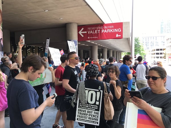 Protesters gathered to demonstrate against President Donald Trump as he spoke to the National Rifle Association convention in Atlanta