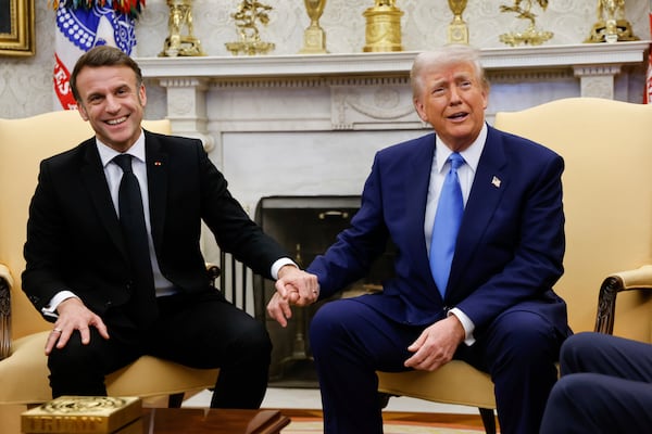 President Donald Trump, right, meets with France's President Emmanuel Macron in the Oval Office of the White House in Washington, Monday, Feb. 24, 2025. (Ludovic Marin/Pool via AP)