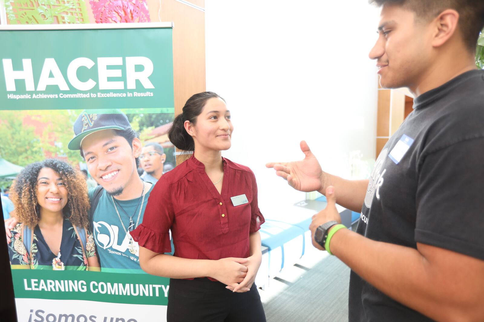 Georgia Gwinnett College students Joel Linares and Lesny Avila interact moments before an event in October 2021. They are part of the college’s HACER (Hispanic Achievers Committed to Excellence in Results) program. (Miguel Martinez for The Atlanta Journal-Constitution)