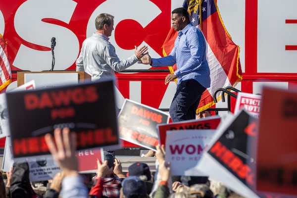 Gov. Brian Kemp, left, is probably Republican U.S. Senate hopeful Herschel Walker's most important ally right now. Polling by a pro-Walker group found that Kemp’s favorability rating among likely runoff voters was 60% while only one-third of voters see him in a negative light. (Steve Schaefer/steve.schaefer@ajc.com)