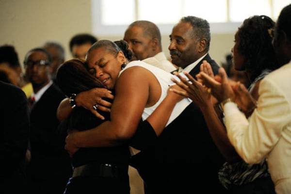 Constance Franklin hugs Morgan Pierce, SGA president for Spelman College after Pierce spoke at her daughter's memorial service. Students, faculty and family members gathered Sept. 8 to remember Jasmine, who was shot last week on the campus of Clark Atlanta University.