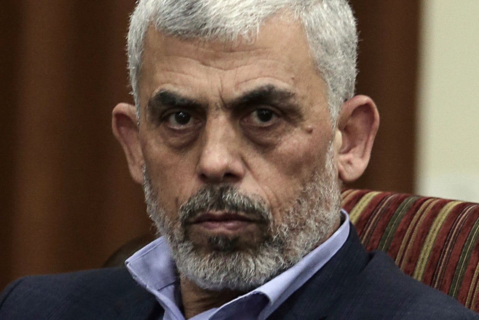 FILE - Hamas leader in the Gaza Strip Yahya Sinwar takes part in a meeting with Egypt's general intelligence chief, Khaled Fawzy and others in Gaza City, on Oct. 3, 2017.(AP Photo/ Khalil Hamra, File)