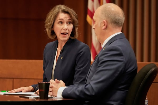 Wisconsin Supreme Court candidates Brad Schimel and Susan Crawford participate in a debate Wednesday, March 12, 2025, in Milwaukee. (AP Photo/Morry Gash)