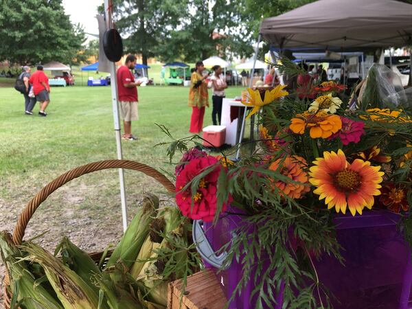 The year-round East Point Farmers Market gathers on the commons area of downtown East Point. Produce varies by season, including corn and colorful fresh flowers in mid-summer. CONTRIBUTED BY EAST POINT FARMERS MARKET