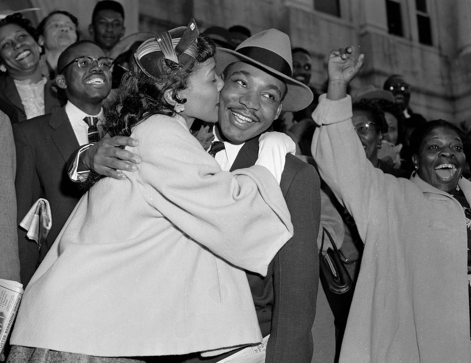 FILE - In this March 22, 1956, file photo, the Rev. Martin Luther King Jr. is welcomed with a kiss by his wife, Coretta, after leaving court in Montgomery, Ala. Court records from the arrests of Rosa Parks, Martin Luther King Jr. and others at the dawn of the modern civil rights era are being preserved after being discovered in an Alabama courthouse. (AP Photo/Gene Herrick, File)