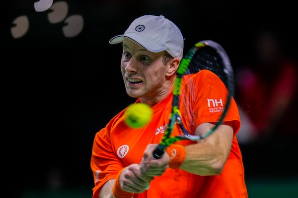 Netherlands' Botic Van De Zandschulp returns the ball against Spain's tennis player Rafael Nadal during a Davis Cup quarterfinal match at Martin Carpena Sports Hall in Malaga, southern Spain, on Tuesday, Nov. 19, 2024. (AP Photo/Manu Fernandez)