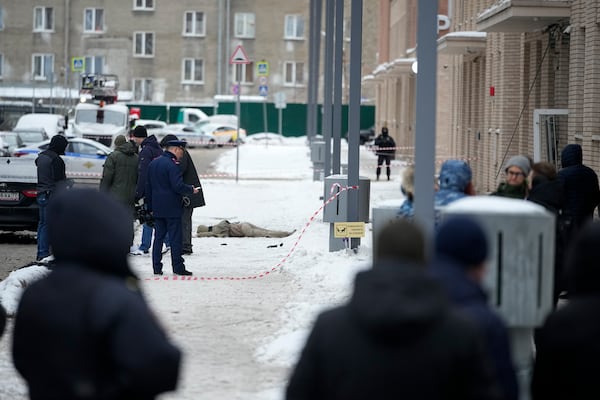 Investigates work at the place where Lt. General Igor Kirillov, the head of Russia's Nuclear, Biological, and Chemical Defence Forces was killed by an explosive device planted close to a residential apartment's block in Moscow, Russia, Tuesday, Dec. 17, 2024. (AP Photo)