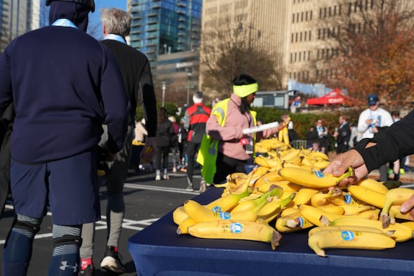 Volunteers handed out thousands of bananas to runners as they completed the inaugural Polar Opposite Peachtree Road Race on Jan. 4.  