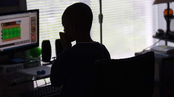 David, 7, was assigned to a 'psychoeducational' alternative school for behavioral issues before his mother enrolled him in an online charter school. HYOSUB SHIN/HSHIN@AJC.COM