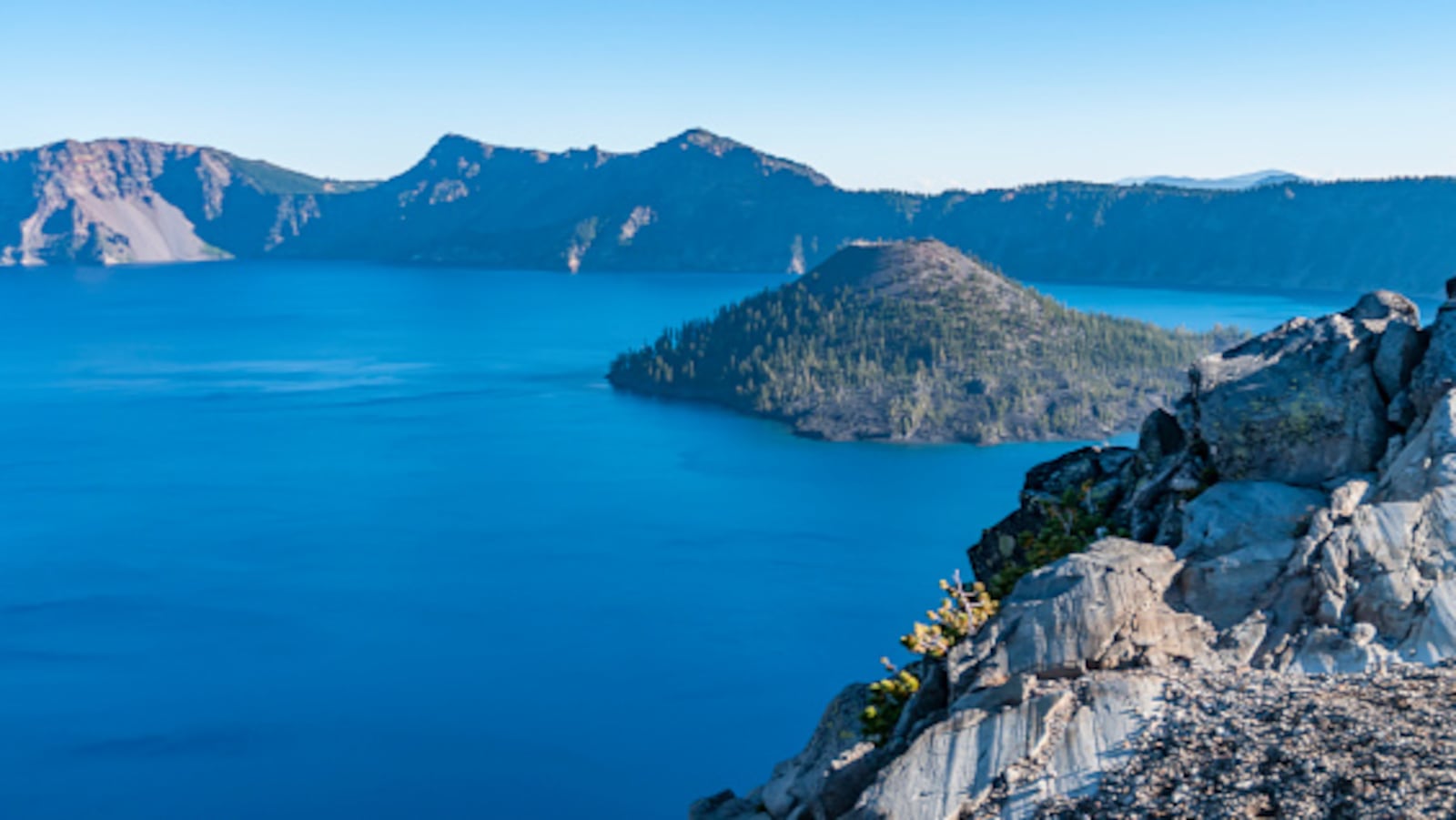 View of Wizard Island, a volcanic cinder cone which forms an island at the west end of Crater Lake in Crater Lake National Park, Oregon. 