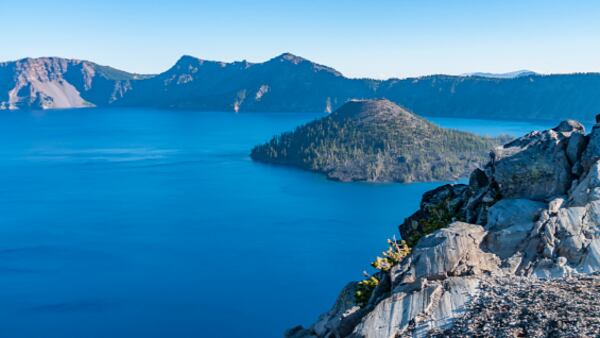 View of Wizard Island, a volcanic cinder cone which forms an island at the west end of Crater Lake in Crater Lake National Park, Oregon. 