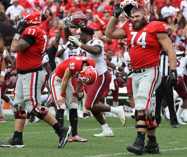 Georgia kicker Rodrigo Blankenship bends over dejectedly, reacting to missing his field goal attempt in double overtime as the Bulldogs lost to South Carolina 20-17 Saturday in Athens.    Curtis Compton/ccompton@ajc.com