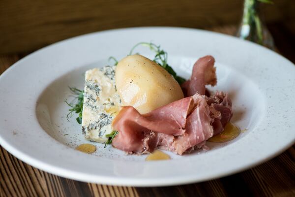  Poached Bartlett pear with prosciutto, Sweetgrass Dairy Asher Blue cheese, pea tendrils, and burnt honey syrup at Local Republic. Photo credit: Mia Yakel.