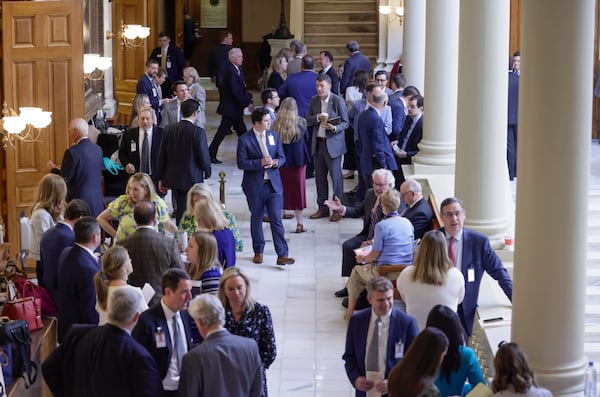 Lobbyists fill the halls of the Capitol on the final day of last year's legislative session. Businesses hire lobbyists specifically to get tax breaks passed because they can mean millions of dollars to a company. Those tax breaks often win passage in the final hours of a session when lawmakers take hundreds of votes and have little time to review what they are voting on. (Bob Andres / robert.andres@ajc.com)