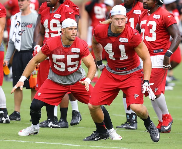 081915 FLOWERY BRANCH: Falcons linebacker Paul Worrilow (left) and outside linebacker Tyler Starr (right) run a defensive drill during team practice on Wednesday, August 19, 2015, in Flowery Branch. Curtis Compton / ccompton@ajc.com