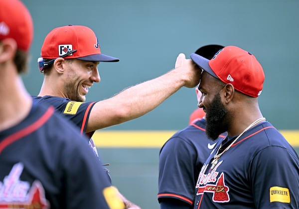 Braves first baseman Matt Olson (left) goofs off with designated hitter Marcell Ozuna during spring training.