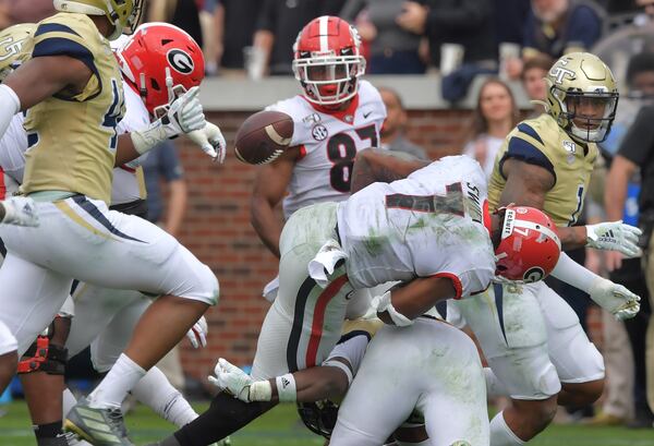 Georgia running back D'Andre Swift (7) fumbles the football during the first half of an NCAA college football game at Bobby Dodd Stadium on Saturday, November 30, 2019. Georgia won 52-7 over the Georgia Tech. (Hyosub Shin / Hyosub.Shin@ajc.com)