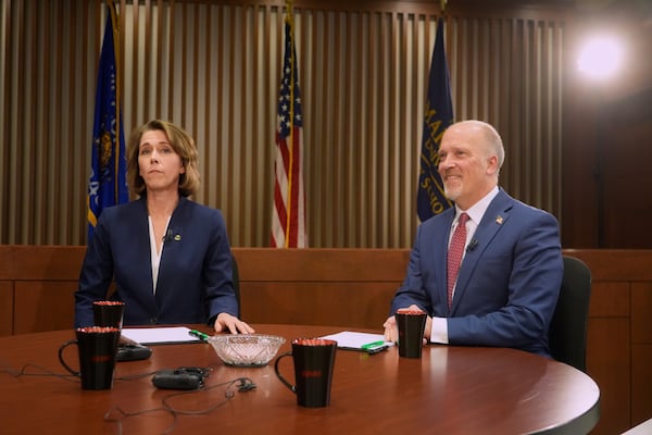 Wisconsin Supreme Court candidates Brad Schimel and Susan Crawford are seen before a debate Wednesday, March 12, 2025, in Milwaukee. (AP Photo/Morry Gash)