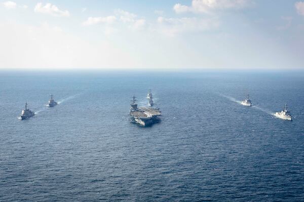 In this photo provided by South Korea Defense Ministry, warships of South Korea, the United States and Japan including the USS George Washington aircraft carrier, bottom center, take part in the trilateral Freedom Edge exercise in international waters off South Korea's southern island of Jeju, Wednesday, Nov. 13, 2024. (South Korea Defense Ministry via AP)