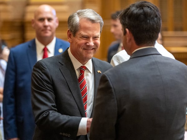 Gov. Brian Kemp greets senators after speaking at the Senate in Atlanta on Sine Die, Wednesday, March 29, 2023.  (Arvin Temkar/The Atlanta Journal-Constitution)