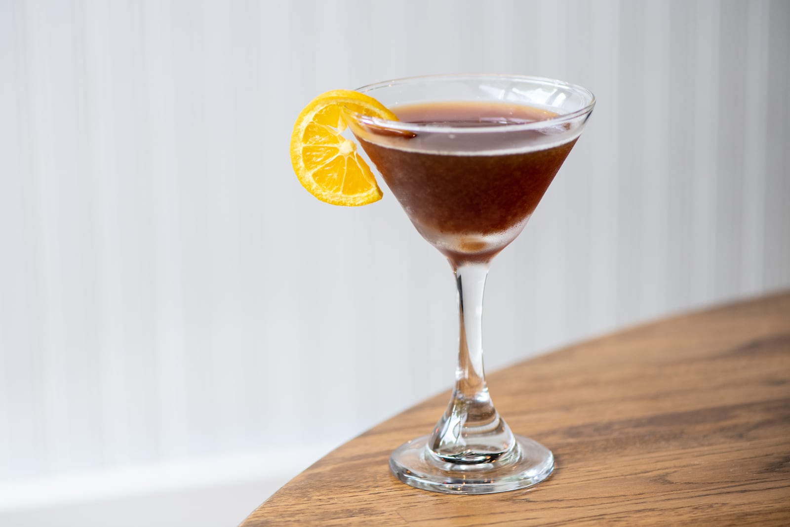 A-street Fixxxxer with Grand Marnier, Cognac Cafe, blackened whisky, Luxardo syrup, and orange. (Mia Yakel for The Atlanta Journal-Constitution)