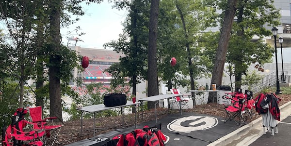 It's very early on the morning of Georgia games when fans arrive to begin the Saturday ritual of setting up tailgates. UGA campus does not open its doors to tailgaters until 7 a.m. This is the "Take No Prisoners" tailgate on Field Street, just outside Gate 8A at Sanford Stadium, on Oct. 5, 2024. (Photo by Chip Towers/ctowers@ajc.com)