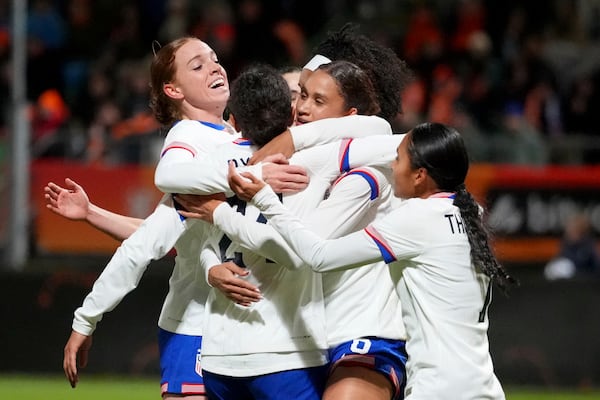 United States' Lynn Williams, center, celebrates after scoring her side's second goal during the international friendly women's soccer match between the Netherlands and the United States at the ADO Den Haag Stadium in The Hague, Netherlands, Tuesday, Dec. 3, 2024. (AP Photo/Peter Dejong)