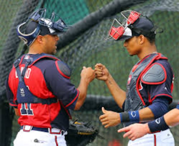 Veteran Gerald Laird (left) believes it's only a matter of time before rookie Christian Bethancourt is good hitter, comparing him to a young Yadier Molina.