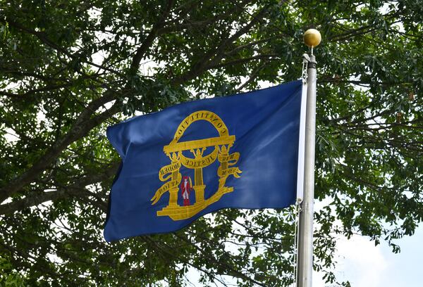 June 16, 2020 Kennesaw - The Confederate battle flag was removed and replaced it with the original Georgia state flag (showing in this picture) that was flown during the Civil War at the city's war memorial in downtown Kennesaw on Tuesday, June 16, 2020. The Kennesaw City Council voted Monday to remove the Confederate battle flag from its war memorial and replace it with the original Georgia state flag that was flown during the Civil War. (Hyosub Shin / Hyosub.Shin@ajc.com)