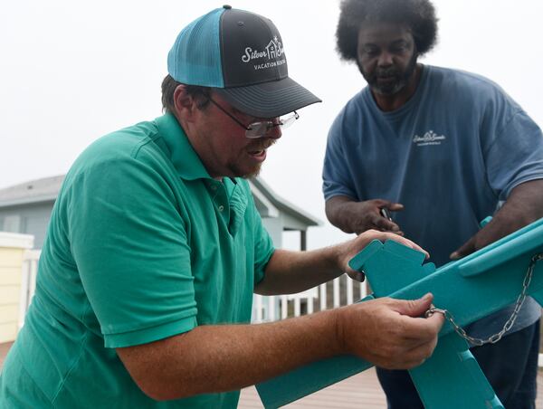 Kenny Gardiner assembles patio furniture, Monday, March 2, 2020, in Port Aransas, Texas. Gardiner is originally from Rusk, Texas, but moved to Port Aransas to find work.