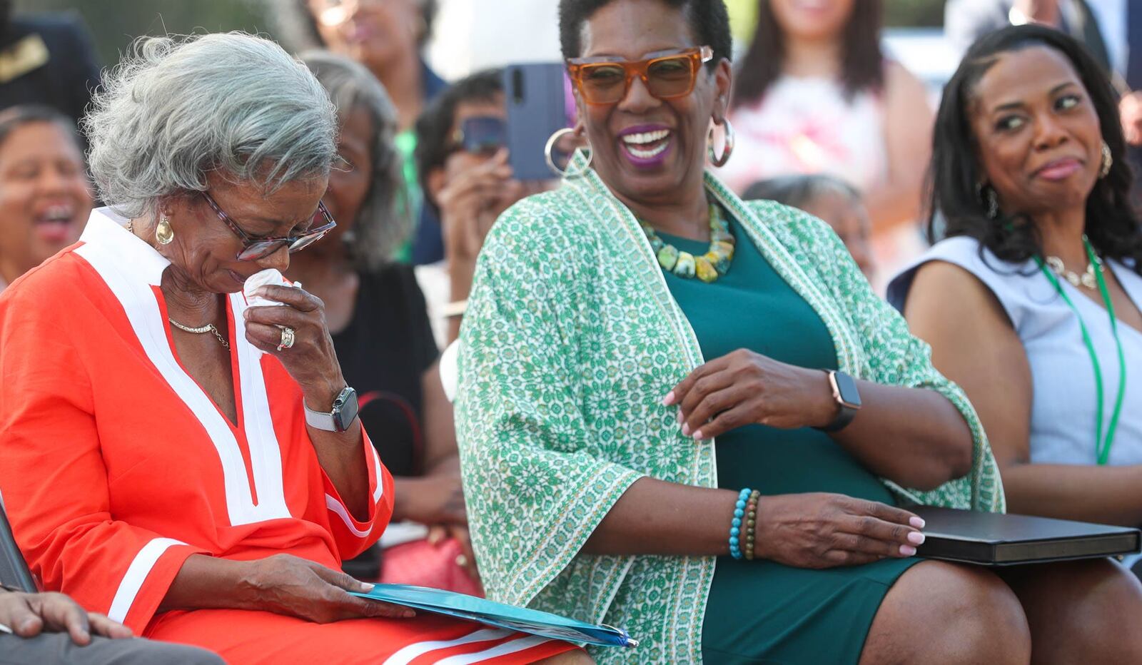 An emotional Virginia Edwards-Maynor wipes aways tears as Mayor Van Johnson talks about her legacy during a special ceremony to designate a portion of Hopkins Street as Virginia Edwards-Maynor Way on Tuesday, August 8, 2023.