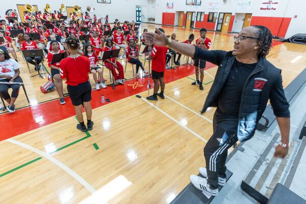 Lynel Goodwin, director of the JHS Majestic Marching Cardinals, leads a Thursday afternoon practice at Jonesboro High School. (Steve Schaefer/steve.schaefer@ajc.com)