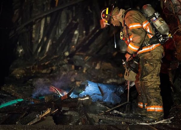 Firefighters work a blaze early Wednesday in Cobb County. BRANDEN CAMP / SPECIAL