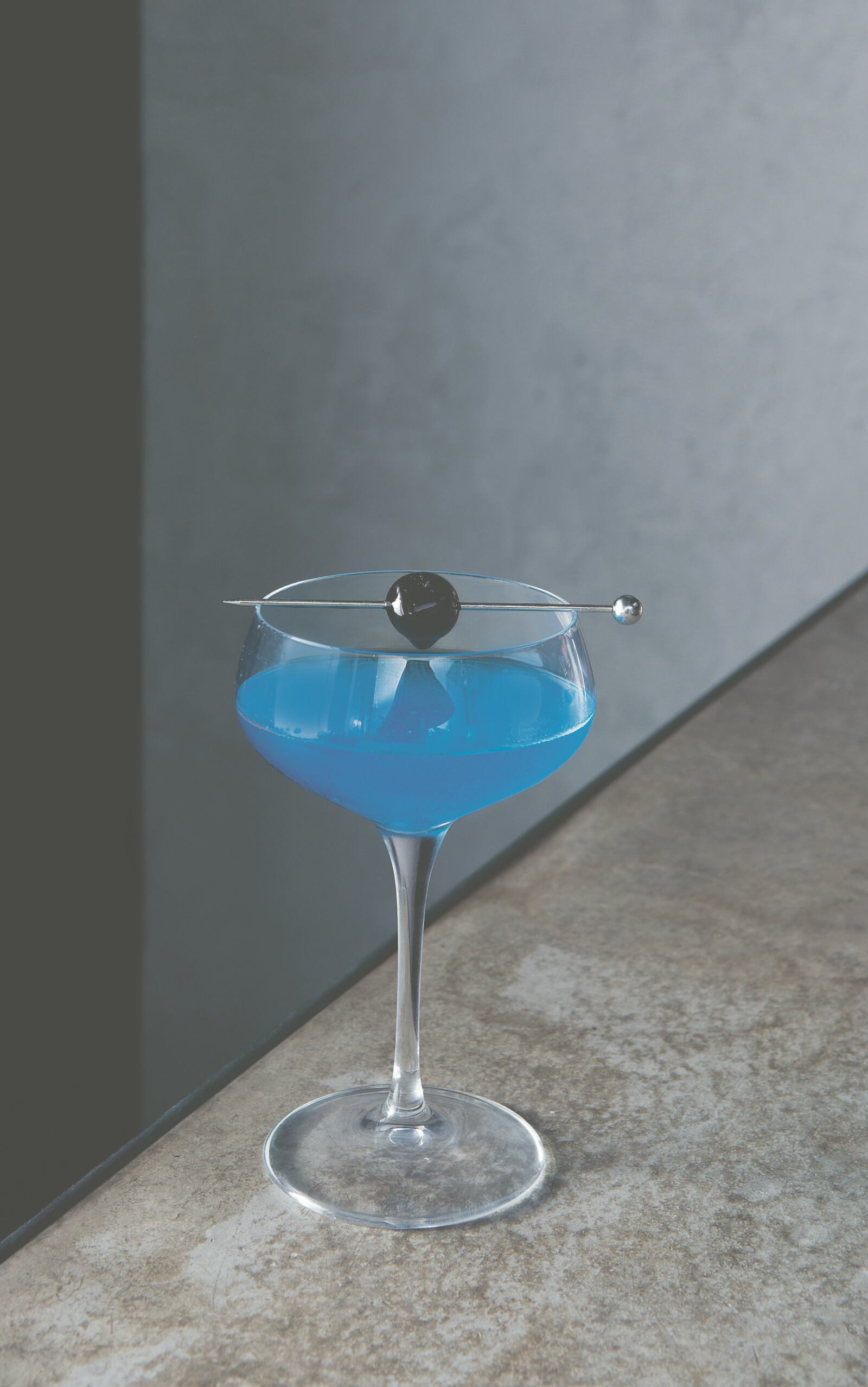 "Spirited," by Adrienne Stillman, offers 610 cocktails from around the world, like this riff on an Aviation, called Blue Devil. Courtesy of Andy Sewell