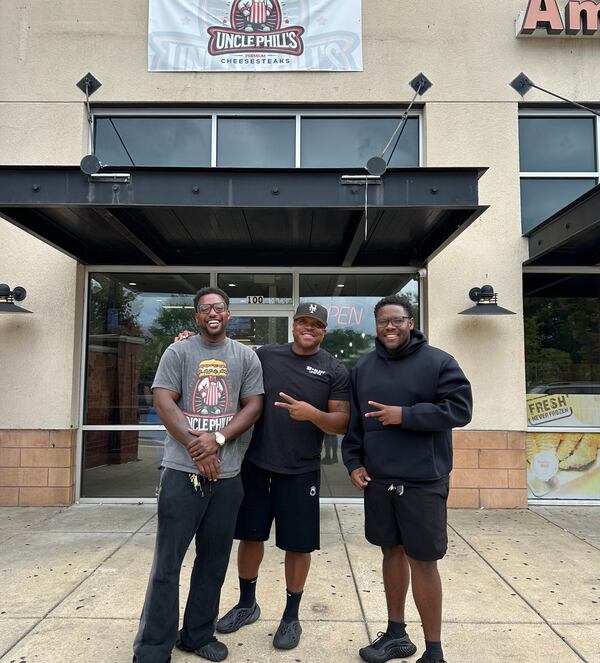 Uncle Phill's opened in East Atlanta last week. Co-owners Donald Ralls (left) and Osaze Proctor (right) pose with the Real Milk & Honey owner Sammy Davis Jr. (center).