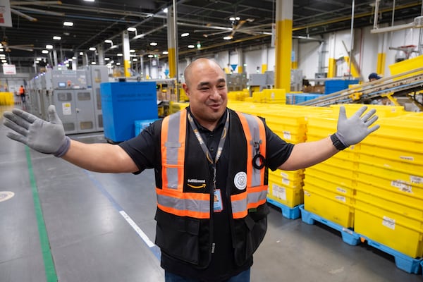 Tony Vozzolo talks about operations inside Amazon’s robotic fulfillment center in Stone Mountain on Wednesday, Oct. 23, 2024. (Ben Gray for the AJC)