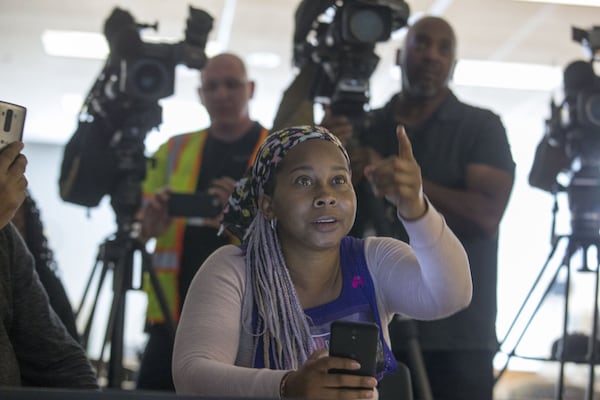 04/30/2018 — Norcross, GA - Nicole Borden asks questions as a Saraland Waffle House security video plays during a press conference at the Waffle House corporate campus headquarters in Norcross, Monday, April 30, 2018. After holding a press conference outside the building, a Waffle House spokesperson invited the protestors inside to watch the recently released security video of 25-year-old, Chikesia Clemons, being violently arrested. ALYSSA POINTER/ALYSSA.POINTER@AJC.COM