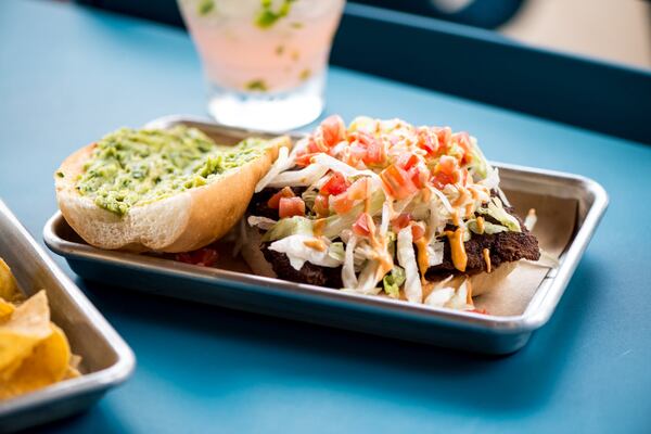 Street Taco Chicken Milanesa Torta with lettuce, tomato, beans, guac, and chipotle aioli. Photo credit- Mia Yakel.